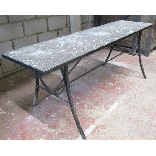 1493 - A marble topped hall table set on an iron frame with swept supports, 193cm x 51cm