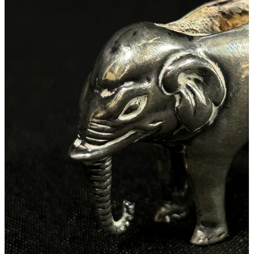 225 - A silver elephant pin cushion, Birmingham 1905, maker Adie & Lovekin Ltd. 4cm wide.