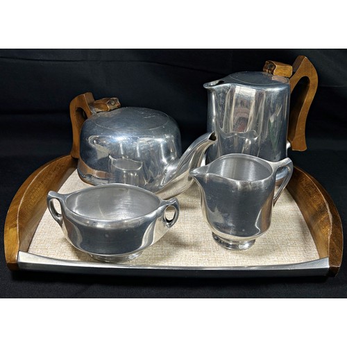 189 - A five piece Piquot ware tea and coffee service with sugar bowl, jug and tray.