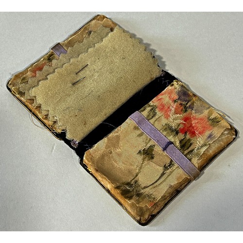 295 - A 19th century pressed horn souvenir needle case, set with five glazed vignettes with studies of Par... 