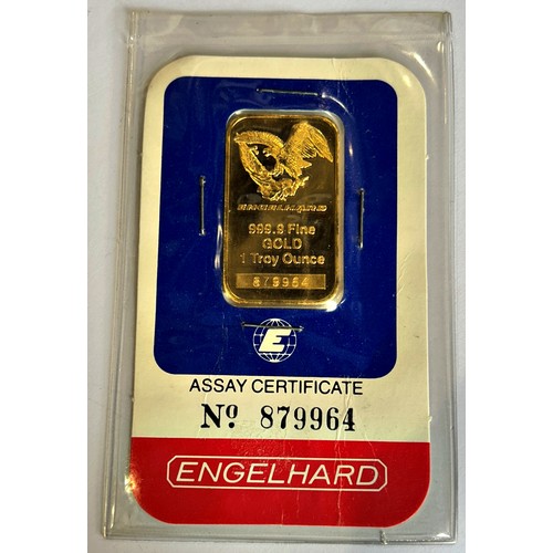 301 - A card slabbed 999.9 fine gold 1 Troy Ounce ingot (Engelhard, USA, certificate 879964).