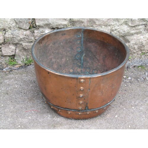 1039 - Small heavy gauge copper cauldron with rolled rim and pop rivetted seams, 29cm high x 42 diameter