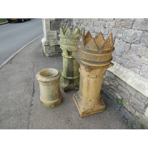 1006 - Pair of weathered buff-coloured crown top cylindrical chimney pots, 94cm high, together with a small... 