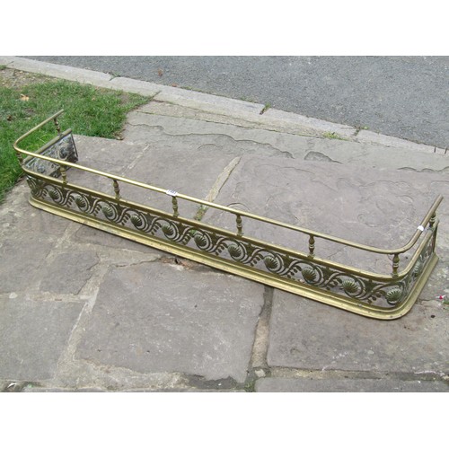 1483 - An early 19th century brass fender with hand cut repeating floral detail, 132cm long x 28cm deep