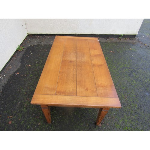 1502 - A contemporary oak occasional table in an antique style finish, with frieze drawer on square tapered... 