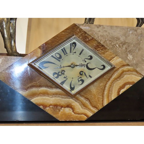 342 - A large early 20th century continental onyx and marble clock garniture in the Art Deco style, the cl... 