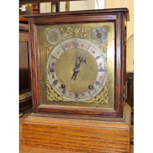 349 - An oak cased bracket clock, with silvered chapter ring and subsidiary dials, 30 x 24cm overall.