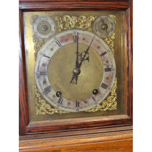 349 - An oak cased bracket clock, with silvered chapter ring and subsidiary dials, 30 x 24cm overall.