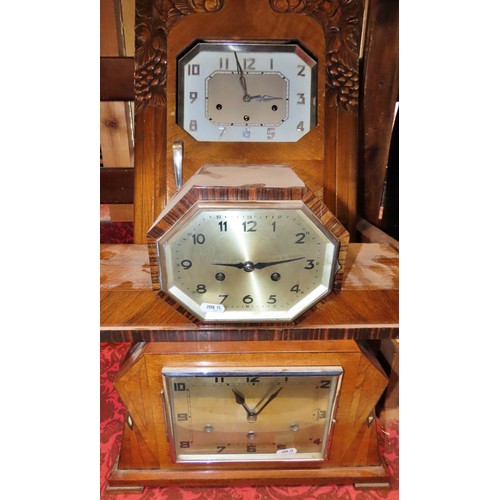 350 - A mixed collection of clocks to include continental walnut wall clocks, others in the Art Deco style... 