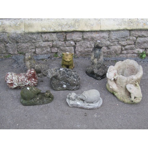 1005 - Eight cast composition stone animal ornaments including dog, cat, hedgehog, etc