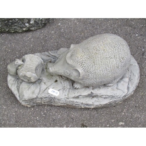 1005 - Eight cast composition stone animal ornaments including dog, cat, hedgehog, etc