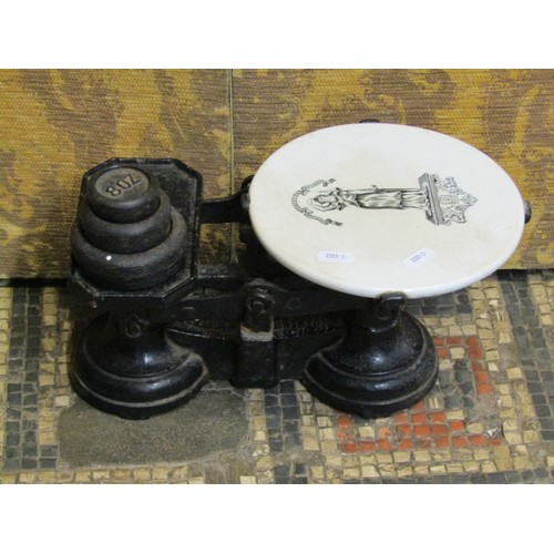 1199 - A set of Victorian kitchen balance weighing scales by Parnell in iron with ceramics tile and a few w... 