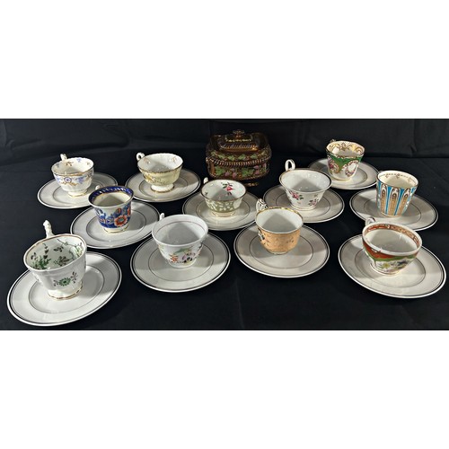 132 - A group of 19th century porcelain cabinet cups, later saucers, etc.