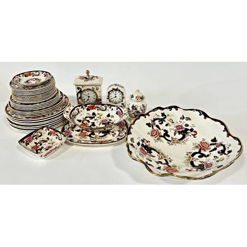 50 - A large quantity of ironstone china to include lamps, vases, a mantle clock, dinner wars etc.