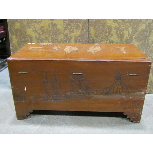 1170 - A Chinese Camphor wood chest with hinged lid and applied character and further detail, 48cm high x 9... 