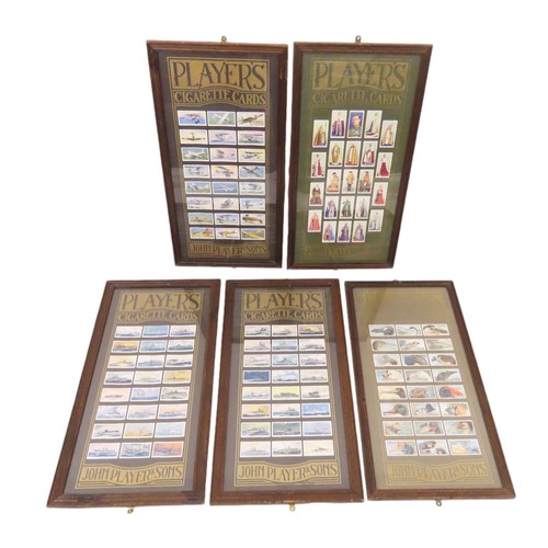 202 - A set of five framed sets of Player's cigarette cards, to include: battle ships, royalty and others,... 