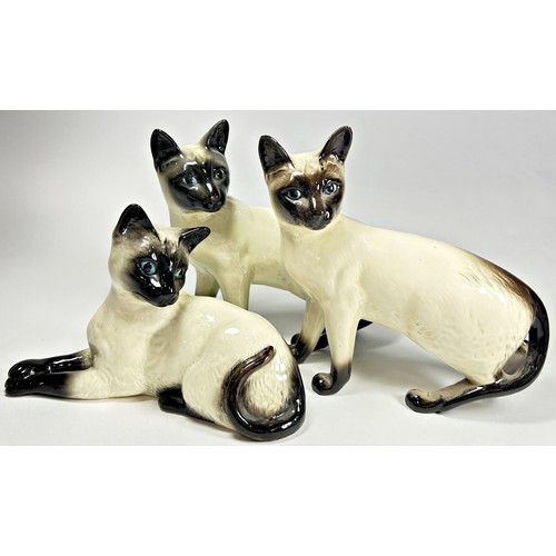 13 - Three Beswick Siamese cats in various poses (3)