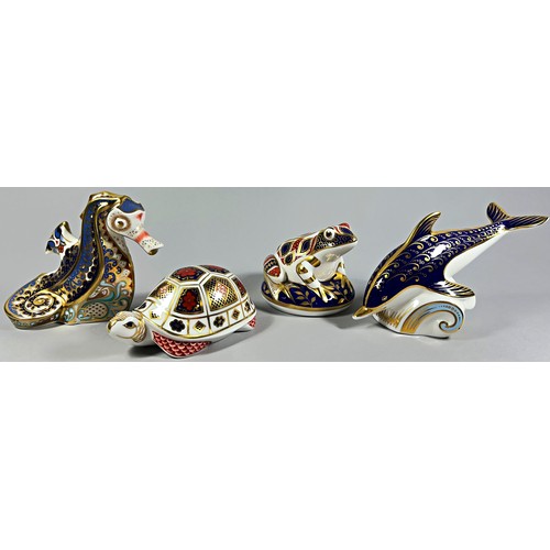 62 - A collection of Royal Crown Derby Imari figures comprising a Dolphin and a Seahorse with gold stoppe... 