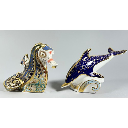 62 - A collection of Royal Crown Derby Imari figures comprising a Dolphin and a Seahorse with gold stoppe... 