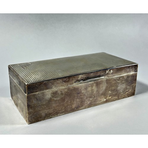 301 - A silver cigarette box, Sheffield 1931, makers mark Walker & Hall, 18cm wide