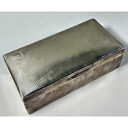 301 - A silver cigarette box, Sheffield 1931, makers mark Walker & Hall, 18cm wide