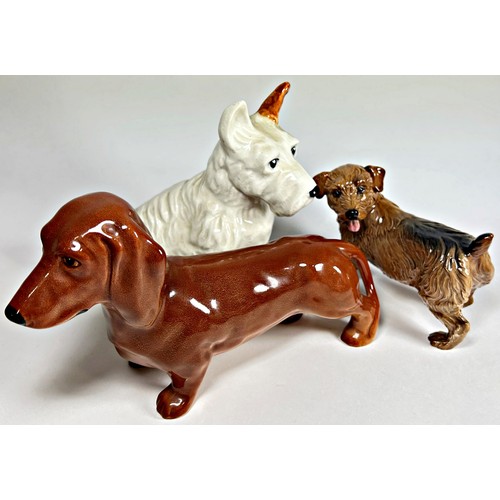 40 - Four Beswick models of dogs to include a white Scotty dog, Dachshund, Corgi, etc, together with a Ro... 