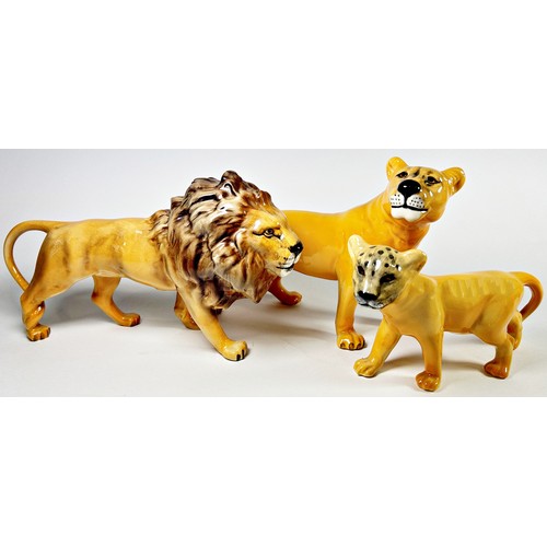 73 - A Beswick lion, lioness and cub (3)