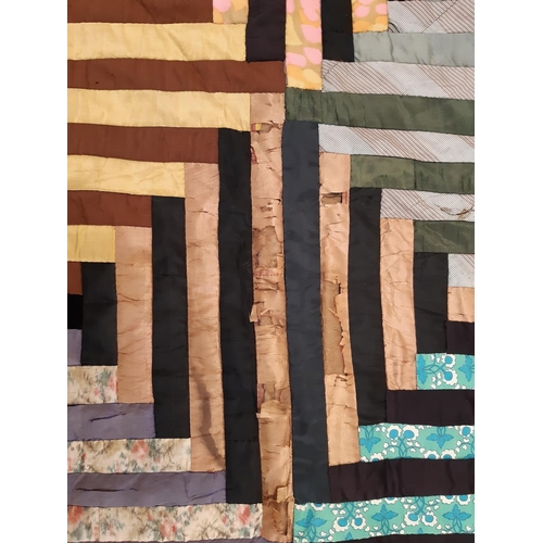 825 - Vintage patchwork quilt, hand stitched in log cabin style, edged in black velvet and lined 168x135cm... 