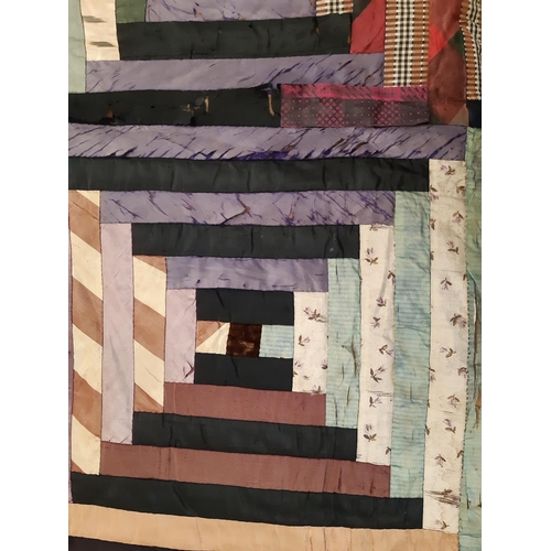 825 - Vintage patchwork quilt, hand stitched in log cabin style, edged in black velvet and lined 168x135cm... 