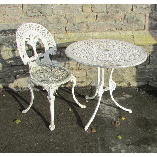 1013 - A cream painted  and weathered cast aluminium garden terrace table with decorative circular pierced ... 