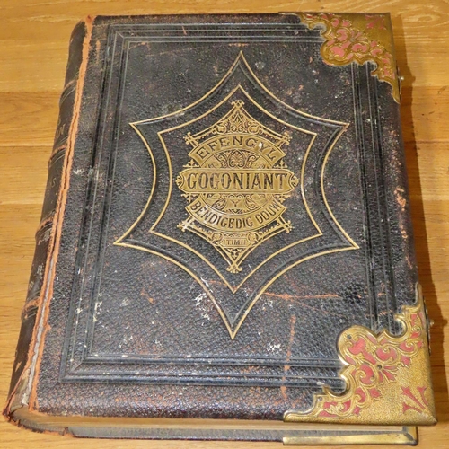 755 - Two Welsh Bibles:
33x27x8cm - gilded corners and clasps, beautifully illustrated with engravings and... 