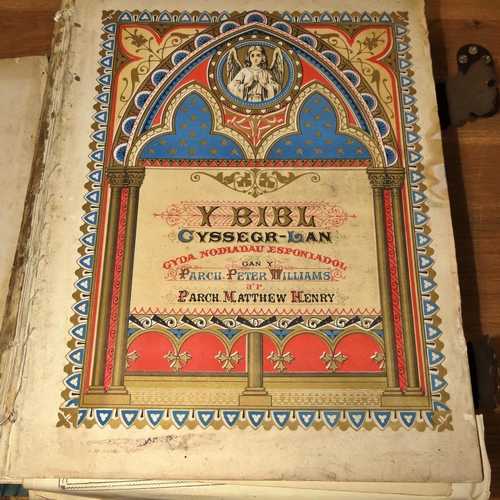 755 - Two Welsh Bibles:
33x27x8cm - gilded corners and clasps, beautifully illustrated with engravings and... 