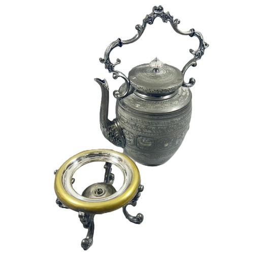 290 - An Indian metal “zodiac” kettle with stand and burner.