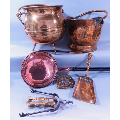 632 - A 19th century brass coal scuttle, a brass cauldron, copper warming pan and a selection of fireside ... 