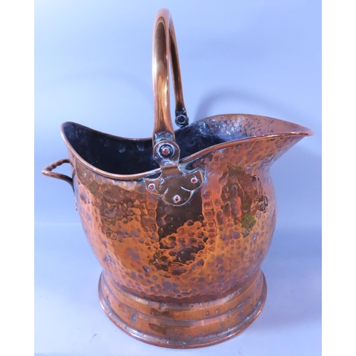 632 - A 19th century brass coal scuttle, a brass cauldron, copper warming pan and a selection of fireside ... 