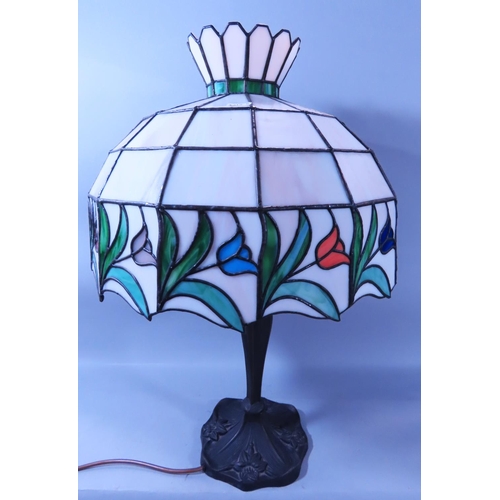 638 - A reproduction Liberty style Art Nouveau style table lamp with a tulip decorated “leaded” shade.