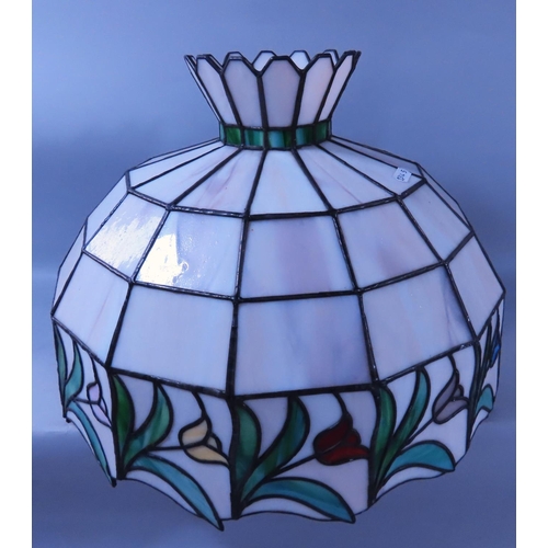 638 - A reproduction Liberty style Art Nouveau style table lamp with a tulip decorated “leaded” shade.