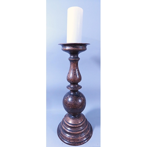 642 - A SUBSTANTIAL BURNISHED BRONZE BALLUSTER SHAPED CANDLESTICK 50CM HIGH