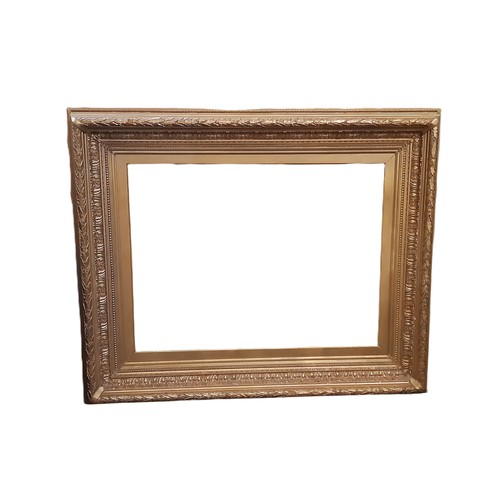 1987 - A large 19th century gilt gesso picture frame with moulded laurel leaf decoration, interior dimensio... 