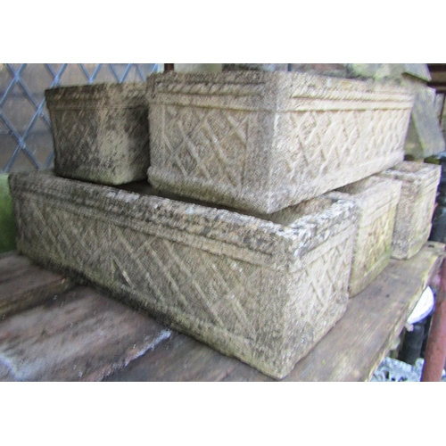 1011 - Five weathered cast composition stone flower troughs of rectangular form with lattice detail (matche... 