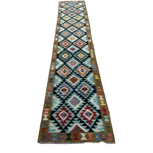 1734 - A Maimana runner with alternating rows of diamonds on a dark ground 399cm x82cm approximately