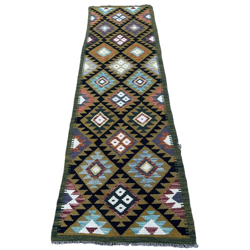 1744 - A Maimana kilim runner with  double rows of stepped diamond on a dark ground 292cm x 83cm approximat... 