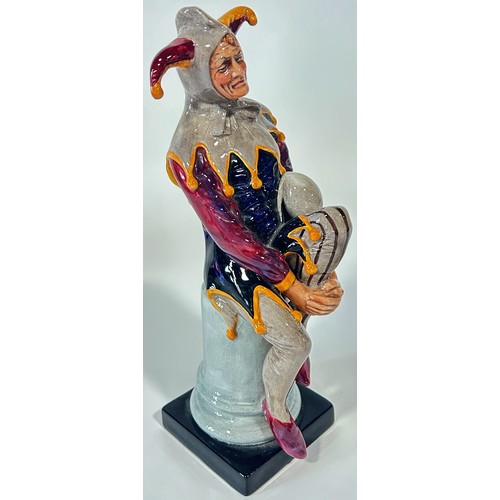 13 - Two Royal Doulton figures, Jester HN2016, and Wizard HN2877