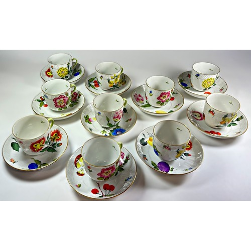 19 - A collection of 10 Herend fruit and floral patterned teacups and saucers