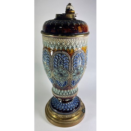 28 - A good Victorian Doulton Lambeth oil lamp with repeating geometric and floral panels, raised upon a ... 