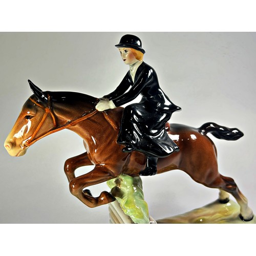 32 - A Beswick model, the Huntswoman, side saddle, clearing a wall, no 982,