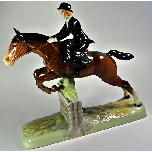 32 - A Beswick model, the Huntswoman, side saddle, clearing a wall, no 982,