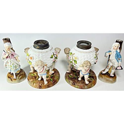 33 - A pair of 19th century German porcelain oil lamp bases in the form of woven baskets, supported by ch... 