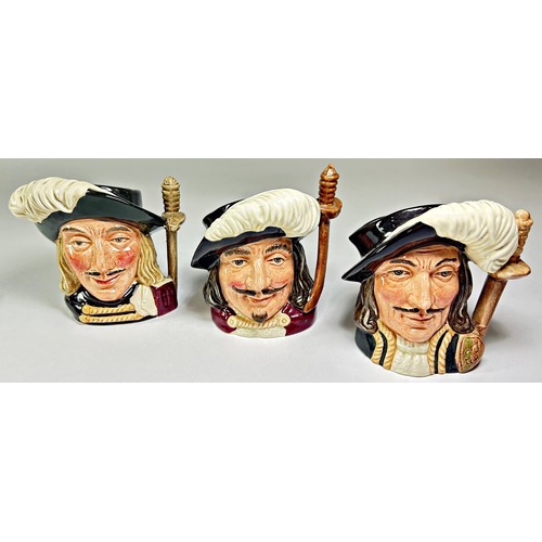 41 - Four Royal Doulton Toby jugs of the Three Musketeers and one other (5) together with two yellow and ... 