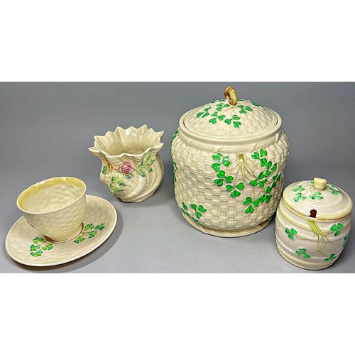 52 - A collection of Belleek porcelain items to include shamrock pattern tea wares, teapots, sugar bowls,... 